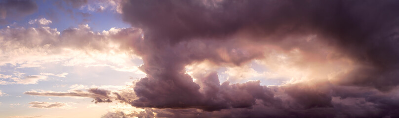 Beautiful Panoramic View of Cloudscape during a colorful and dramatic sunset or sunrise. Taken on the West Coast of British Columbia, Canada.