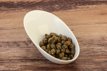 Tasty capers in the bowl