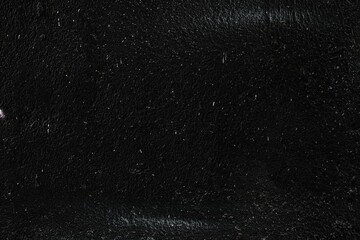 White Paint Splatters on Black Concrete Wall Texture Background.