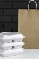 Styrofoam box for food. Toxic plastic waste. Concept of recycling and environmental conservation.