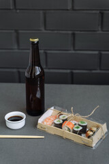 Sushi and rolls delivery service consept on dark  background (template, open space, top view).