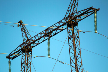 high-voltage support against the blue sky