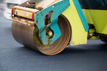 Repair of roads. Laying asphalt with a roller.