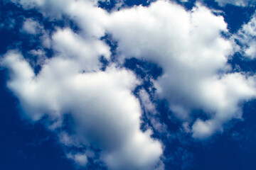 White clouds cumulus floating on blue sky for backgrounds concept