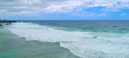 Cloudy with seascape and beach in tropical. Ocean with a wave.
