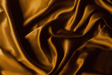 Golden silk close up background.