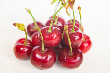Ripe cherries on wooden surface