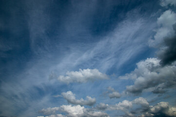 Blue sky, high, majestic Cumulus clouds, the Sun.