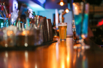 a glass of beer on the bar