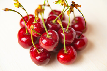 Ripe cherries on wooden surface