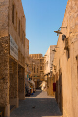 Doha, Qatar, Year 2019: Hallways with shops in the Souq Waqif tourist market. Traditional construction.