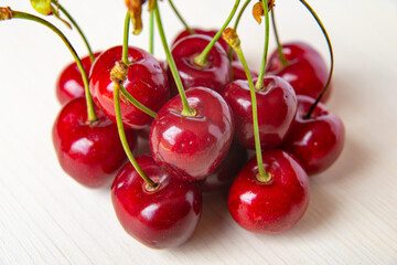 Ripe cherries on wooden surface