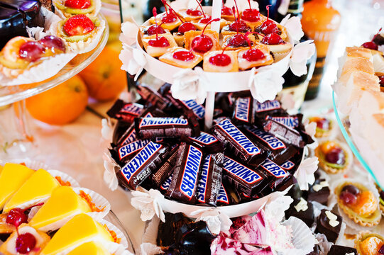 Khutir, Ukraine - May 8, 2016: Snickers minis candy bars heap on wedding reception