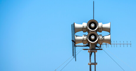 urban emergency warning system against a blue sky