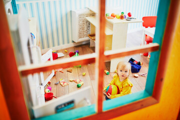 Adorable little girl in kindergarten, daycare or preschool