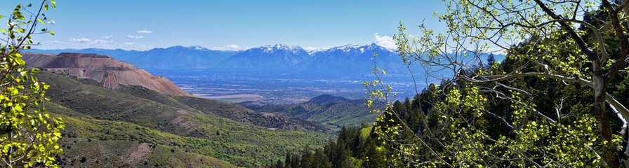 Rocky Mountain Wasatch Front peaks, panorama landscape view from Butterfield Canyon Oquirrh range by Rio Tinto Bingham Copper Mine, Great Salt Lake Valley in fall. Utah, United States.
