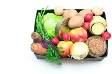 supplies food help box full of vegetables, canned, cereal, eggs and fruits. donation for charity with copy space. coronavirus volunteer donation isolated on white background