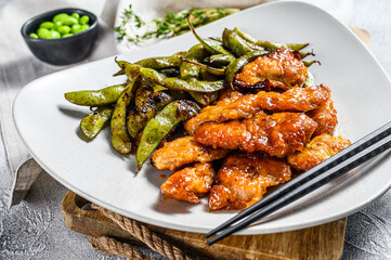 Spicy pork in sweet and sour sauce. White background. Top view