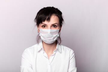 girl in a white shirt and medical mask
