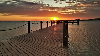 Fototapeta na wymiar Sunset behind wooden deck