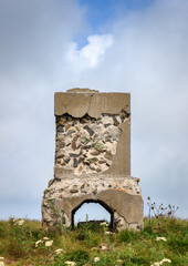 Silver head (Srebrna glava) summit and border stone on the border between Serbia and Bulgaria on a cloudy day