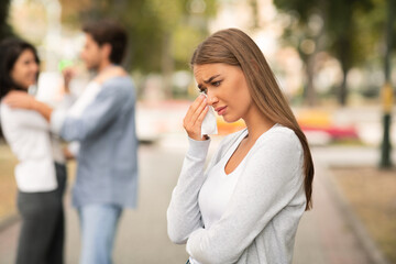 Girl Crying Seeing Boyfriend Hugging Other Woman In Park