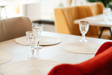 Tables  in an empty cafe during pandemic. No guests. Served table.