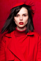 beautiful woman with flying hair, red background