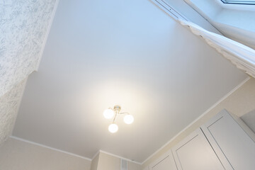 Stretch classic white matte ceiling in the interior of the kitchen