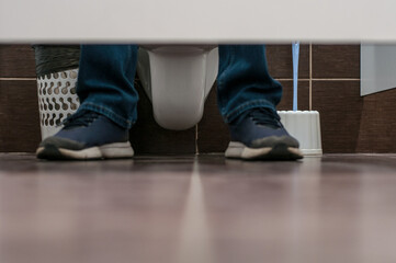 busy toilet. feet out of the toilet