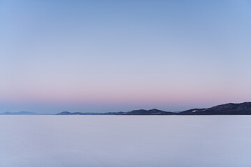 Obraz premium Snow-covered surface of Baikal Lake with track of bicycle. Siberia, Russia