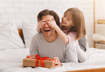 Preschooler girl greeting her beloved dad with birthday