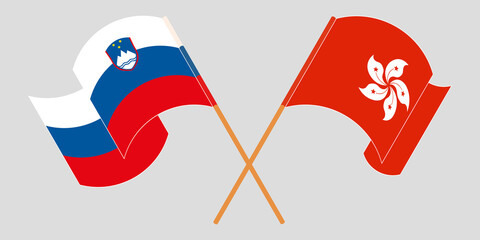 Crossed and waving flags of Slovenia and Hong Kong