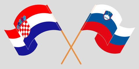 Crossed and waving flags of Slovenia and Croatia