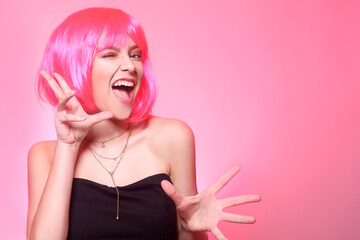 Girl with pink hair, brown hair. Model shows a kitty