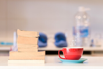 cup of coffee with books