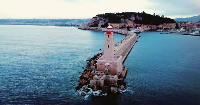 Nice, France, Aerial footage of lighthouse. Beautiful sunrise above the Mediterranean Sea. Cote D Azur