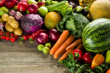 grown vegetables products summer harvest of fresh vegetables on the table, grapes apples eggplant cucumbers zucchini potatoes