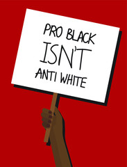 Hand holding a PRO BLACK ISN’T ANTI WHITE protest placard