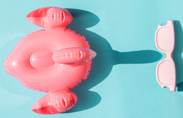 Beach accessories on blue background.Summer vacation. Creative concept.Travel mood to the sea.