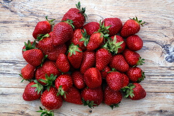 strawberry on top of a wooden table