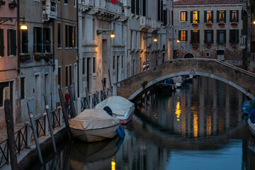Fototapeta na wymiar fascinating water canal at dusk in Venice Italy
