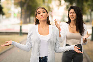 Two Girls Having Quarrel Ending Friendship Standing Outside