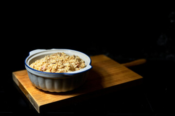 three delicacies rice in white jar with black background