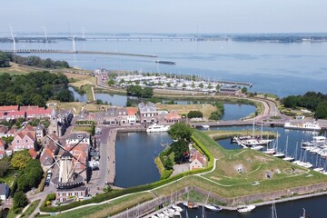 Aerial view of picturesque fortress town of Willemstad in the Netherlands, Brabant. With mill and ports.
