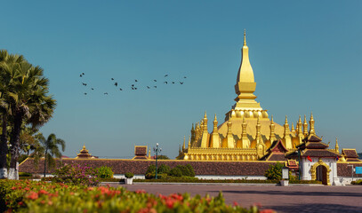 Golden Pagoda in Vientiane, Laos. Pha That Luang at Vientiane. Blue sky background beautiful.