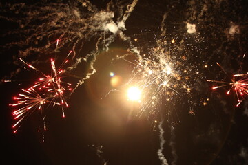 Festive fireworks in the night sky. New Year, Christmas