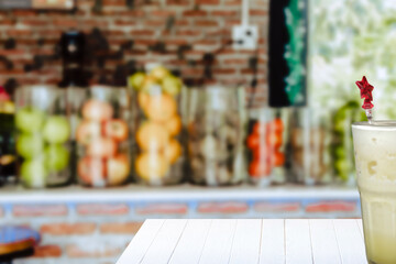 Coconut smoothie on the white table in the juice shop