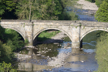 Fototapeta premium A three span stone bridge leading in to Richmond North Yorkshire, United Kingdom