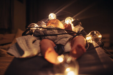 legs of the baby on a deck chair with backlight.